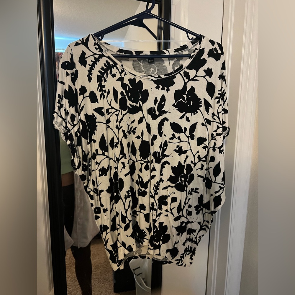 Black and white top fits loosely Very cute.